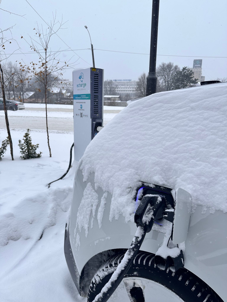 Electric cars charging in blizzard conditions