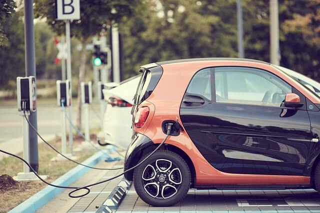 An electric car using an electric car charger