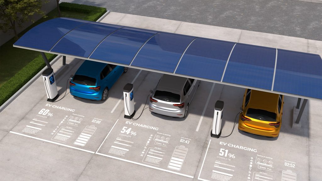 Multiple electric vehicles are charged at a commercial electric vehicle charging station.