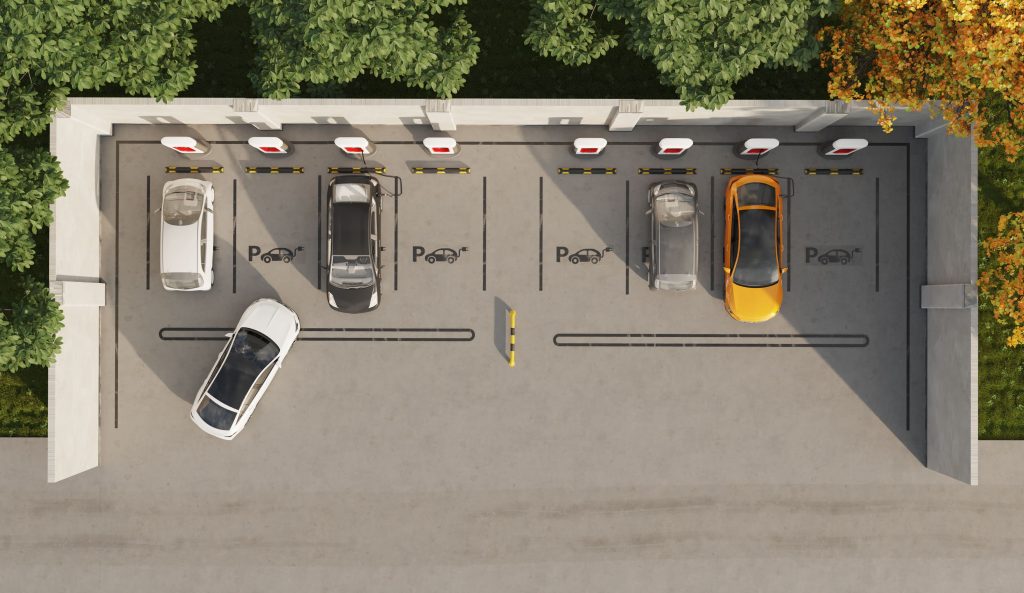 At the charging station, there are eight charging stations, four of which already have cars charging and one car ready to charge.